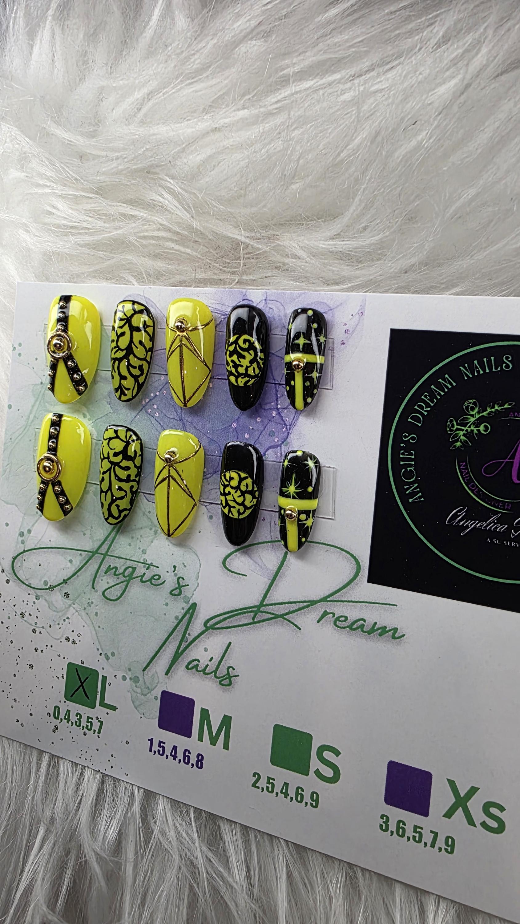 Midnight spell]medium round]press on nails]yellow and black]gold line work