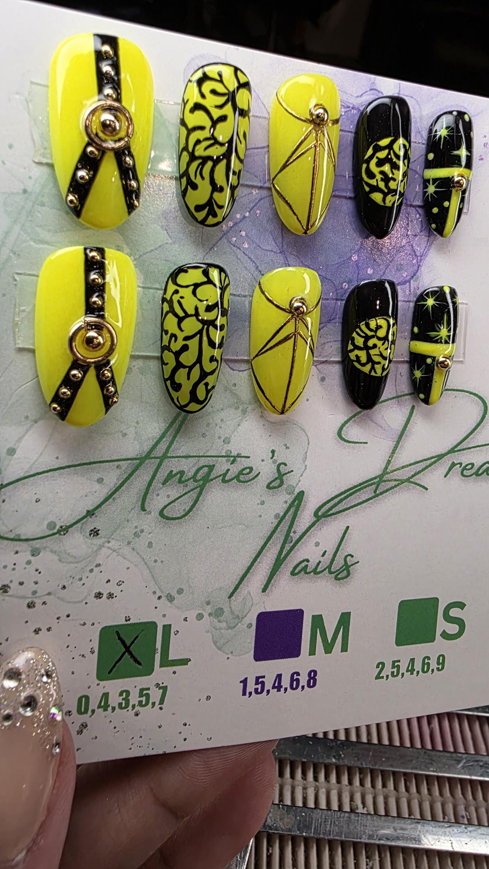 Midnight spell]medium round]press on nails]yellow and black]gold line work