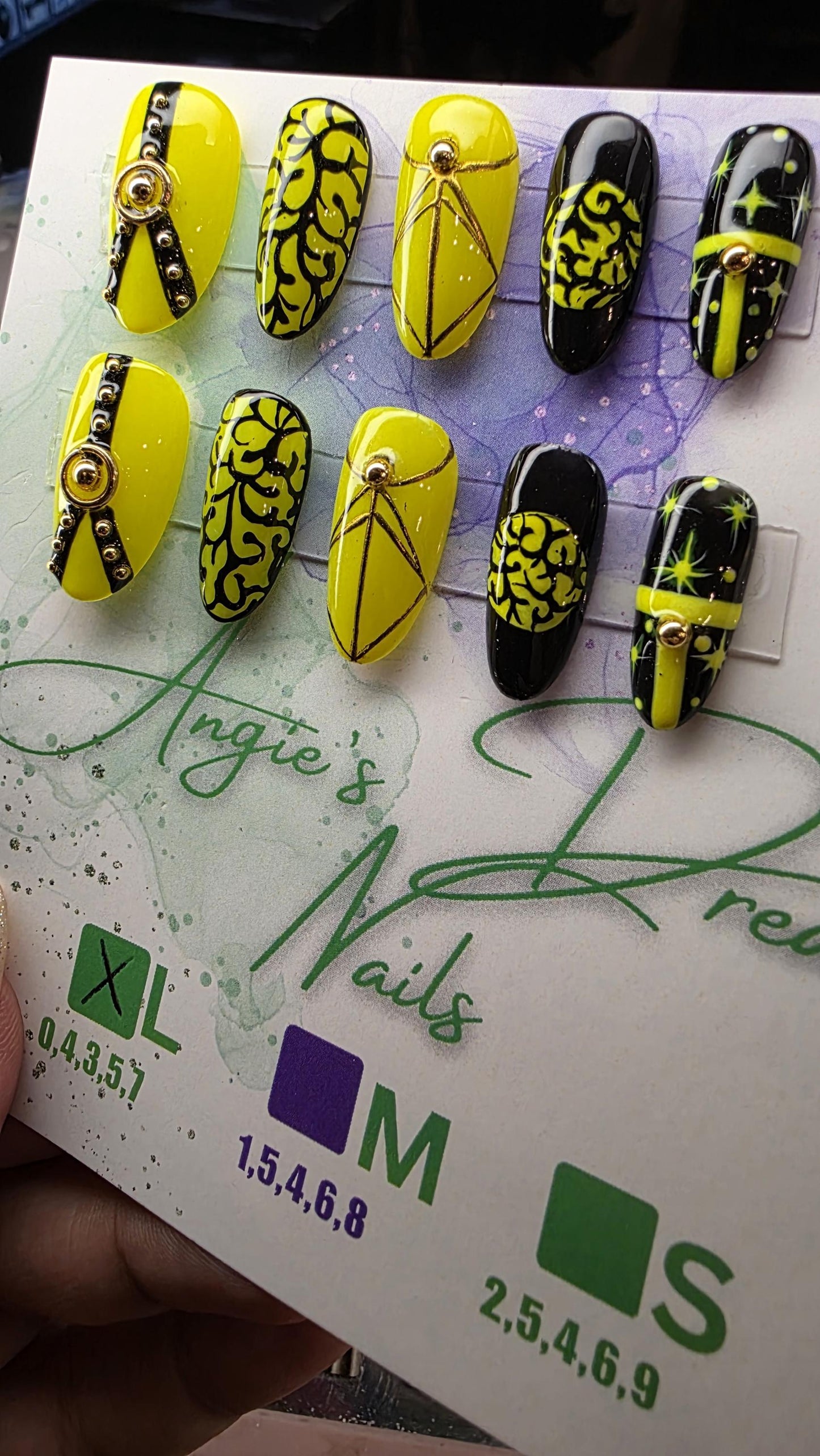 Midnight spell]medium round]press on nails]yellow and black]gold line work
