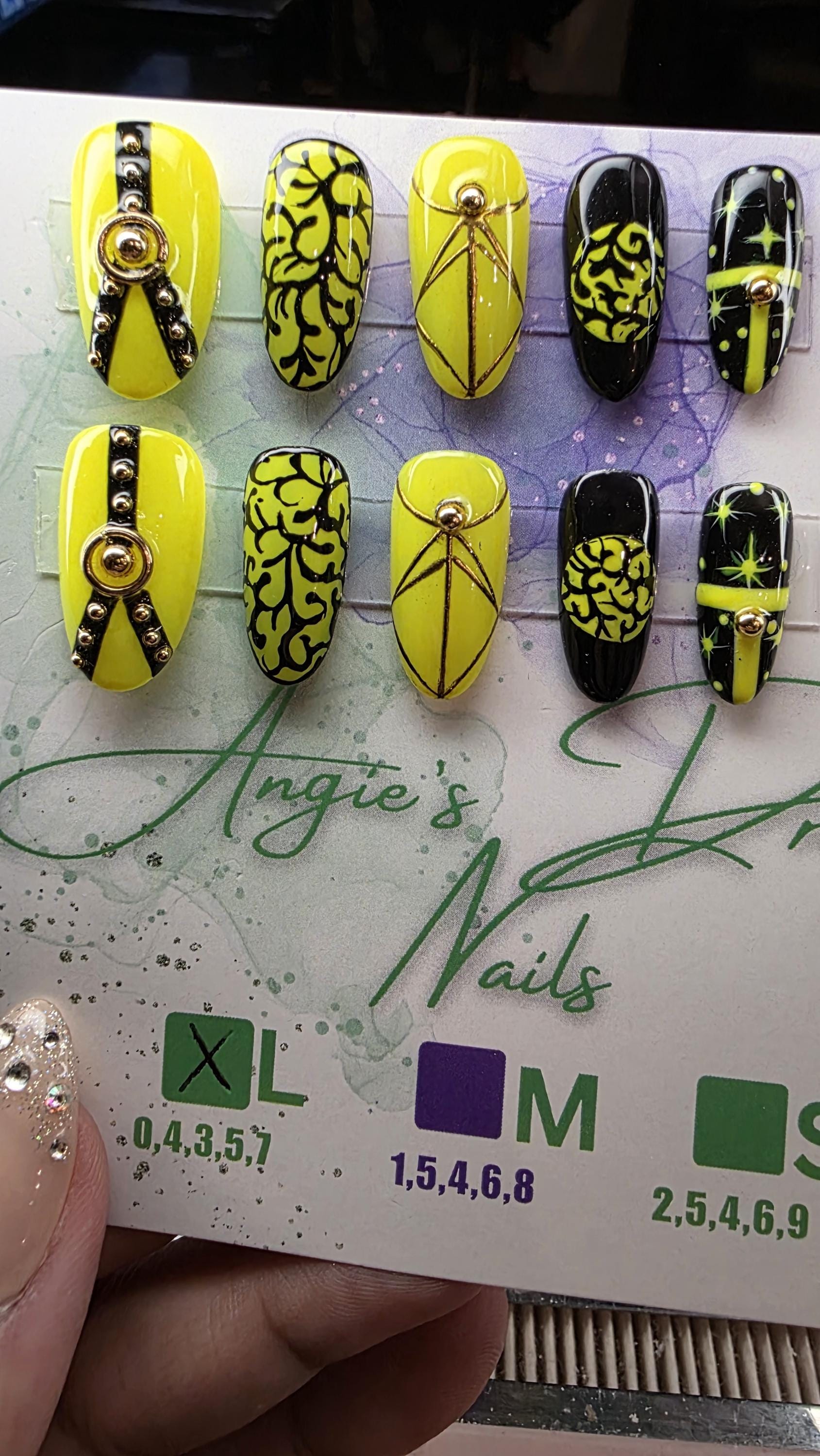 Midnight spell]medium round]press on nails]yellow and black]gold line work